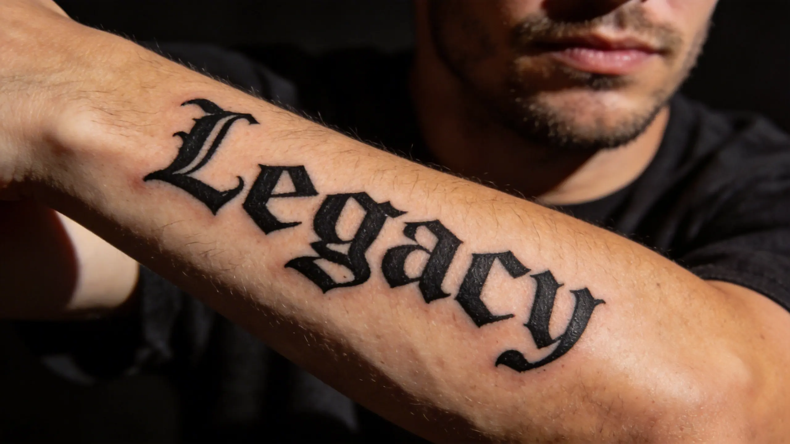 Blackletter script lettering tattoo
