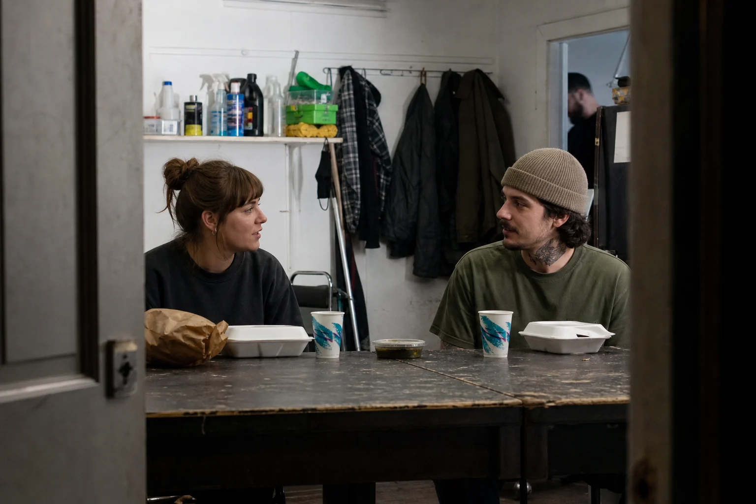 Tattoo artists laughing together between appointments