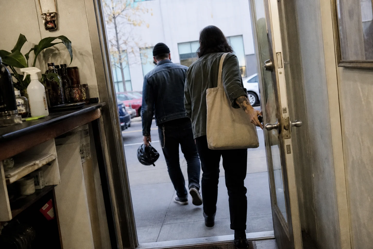 Tattoo artists leaving the studio together after a day's work